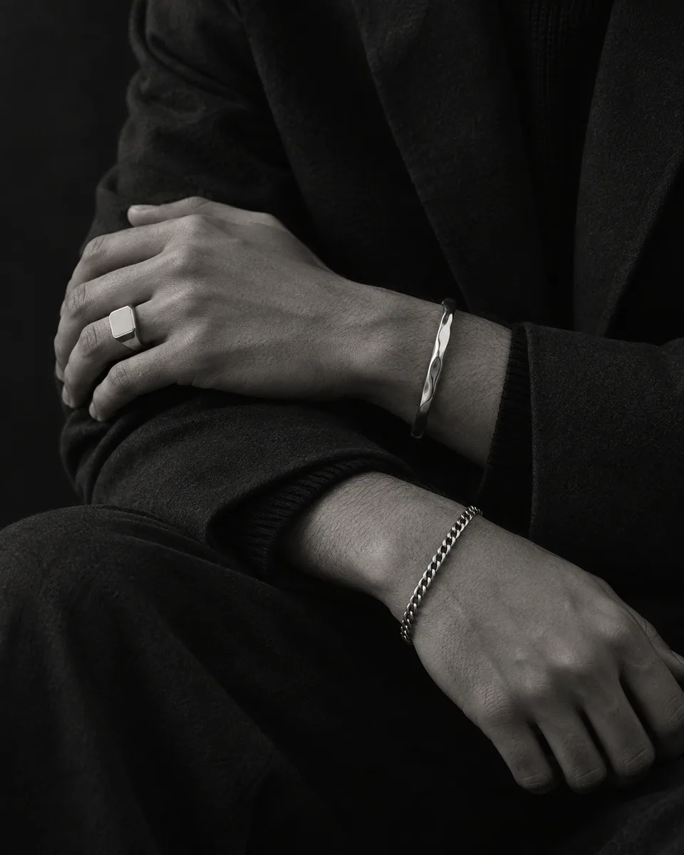 BlackSheep signet ring and cuff worn with a dark suit